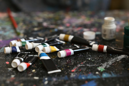 Acrylic paints in tubes still life on table in art class or artist studio workplace.の写真素材
