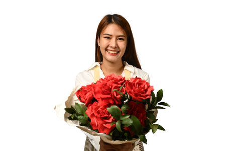 Cheerful young woman florist holding beautiful bouquet of red roses isolated on white background.の写真素材