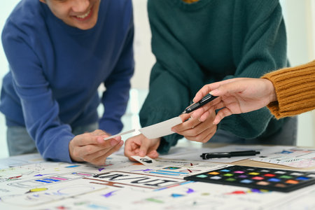Team of creative designer working on app design and user interface, developing mobile application at...