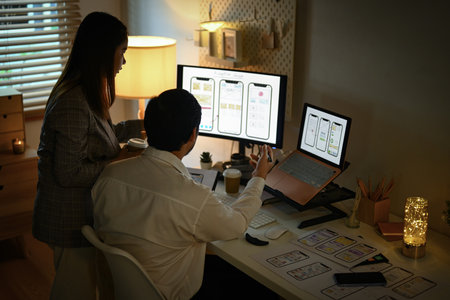 Creative team working on development project for mobile application at office. User experience...