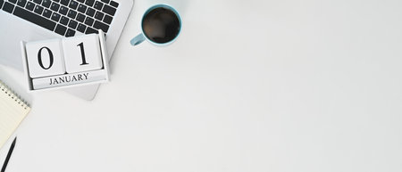 Top view wooden block calendar with the date December 31 on white table. Last day of the year.の写真素材