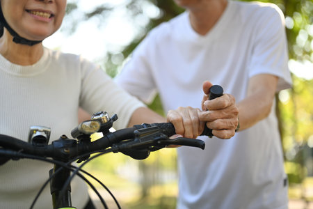 Active senior couple enjoying riding bikes together in nature. Healthy lifestyle conceptの写真素材