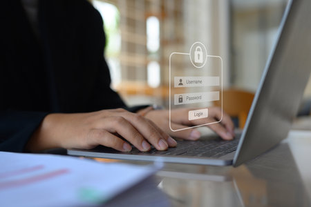 Businesswoman typing the password on laptop to access account on website. Cybersecurity concept.
