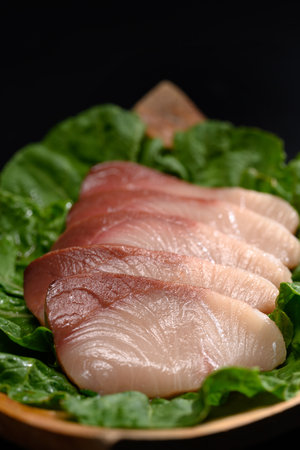 Shime Saba or raw mackerel salted and marinated in vinegar on black plate. Japanese food style.の写真素材