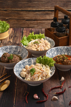 Tasty rice noodles soup with pork and meat ball in ceramic bowl. Asian food.