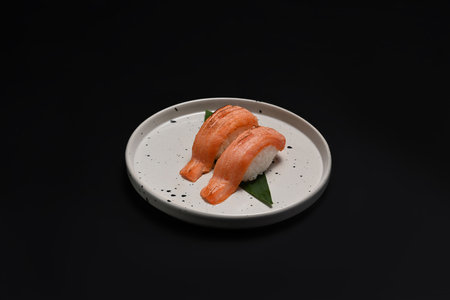 Salmon Aburi Sushi on black background. Japanese food style concept.の写真素材