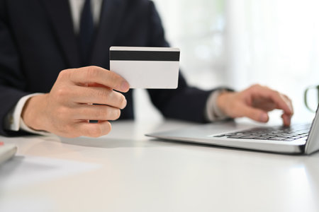 Businessman making a purchase or payment with credit card online.の写真素材