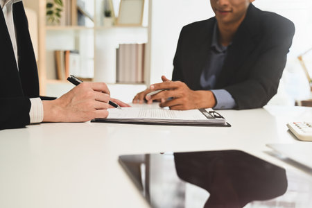 Financial advisor explaining investment options with a client.の写真素材