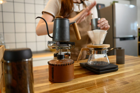 Close up of pour over coffee setup with kettle and dripper in home kitchen.の写真素材
