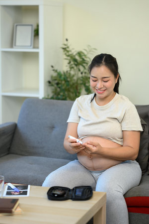 Home blood glucose testing during pregnancy.の写真素材