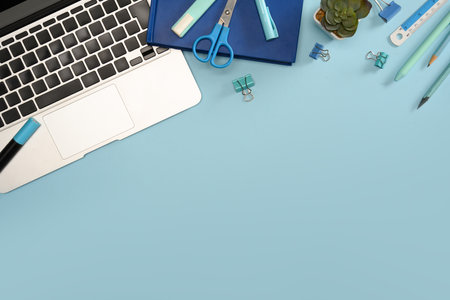 Top view of creative workspace with laptop office supplies.の写真素材