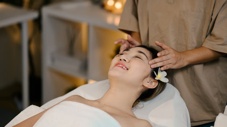 Closeup Attractive Woman Enjoying Face Massage. Beauty procedure.