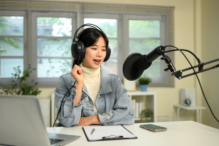 Content creator recording an audio session or live streaming at home.の写真素材