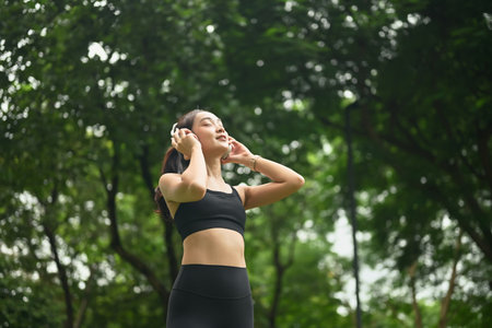 Serene asian runner woman enjoy fresh air with gratitude.