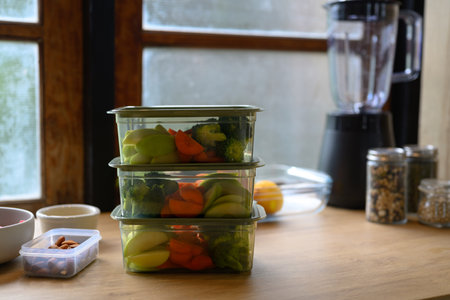 Dividing food into meals weekend meal prep for weight loss, Portion control with food container.
