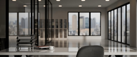 Empty white office table with city view on windows, 3D rendered.の写真素材