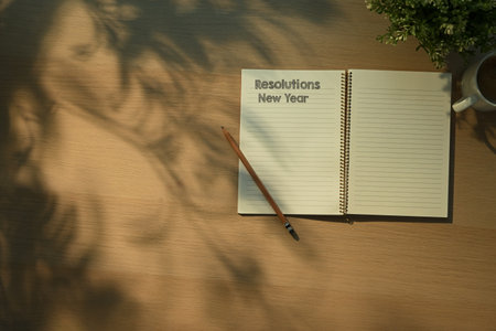 Challenge concept, Notebook with New Year Resolutions text, coffee in morning new year..の写真素材