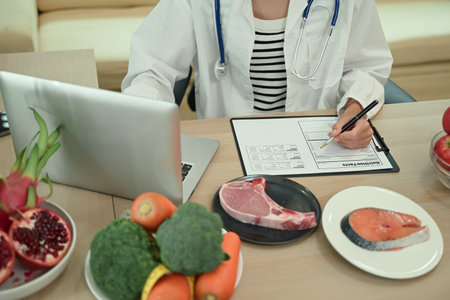 Closeup Woman dietitian working on a nutrition fact , Weight loss and right nutrition concept.の写真素材