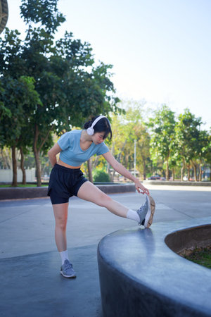Sports woman warming up during training.