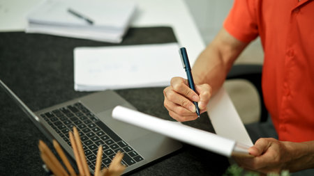 Document with a man checking searching document legal prepare paperwork or report for analysis.