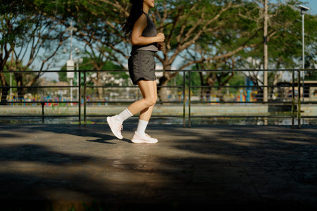Closeup woman running in the park.