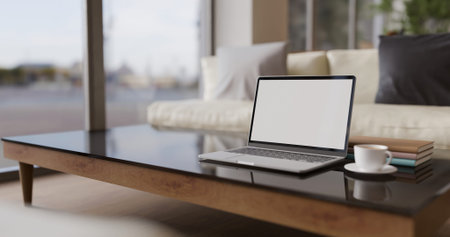 Modern office lounge with sofa set Empty screen laptop and coffee table 3D rendering.の写真素材