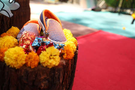 A pair of shoes for the upcoming baby at baby shower