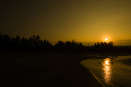 The positive vibes getting from Sunrise on a lonely beachの写真素材