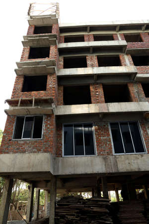 A under construction building and apartment with 4 floors and 1 ground floorの写真素材