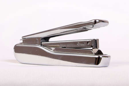 A stapler used to attach a bunch of papersの写真素材