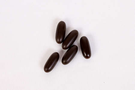 The multivitamin pills in brown colourの写真素材
