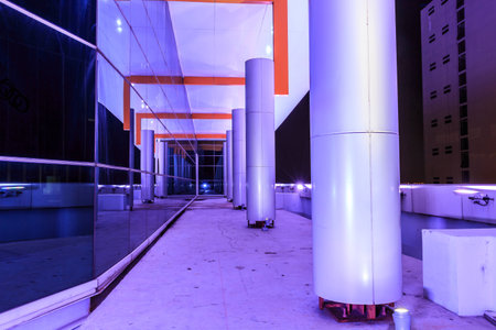 wall glass at night of the top of building in Bangkokの写真素材