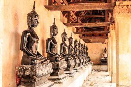 row seated buddhra in the templeの写真素材