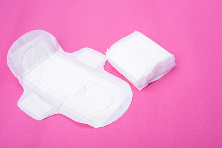 Woman hygiene protection (sanitary) on paper background