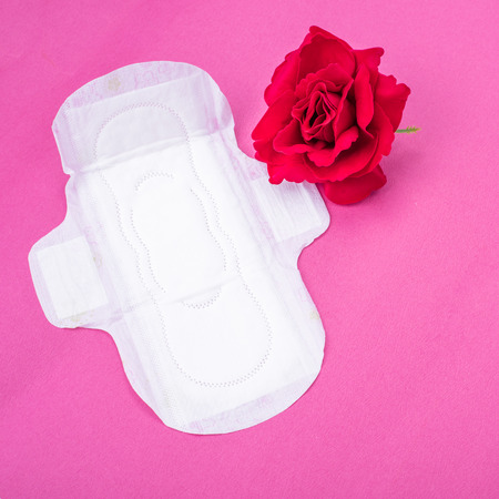 Woman hygiene protection (sanitary) on paper backgroundの写真素材