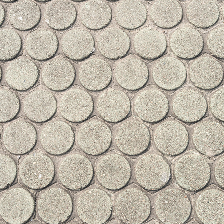 patterned paving tiles, cement brick floor backgroundの写真素材