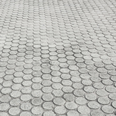 patterned paving tiles, cement brick floor backgroundの写真素材