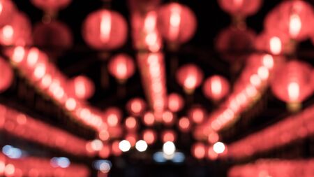 A blurred shot of red Chinese lanterns use a Seamless.の写真素材