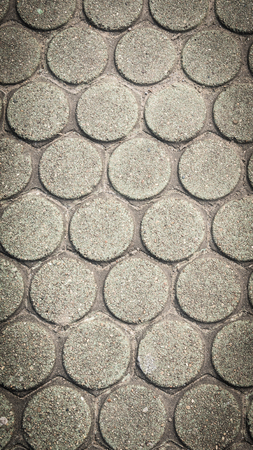 patterned paving tiles, cement brick floor backgroundの写真素材