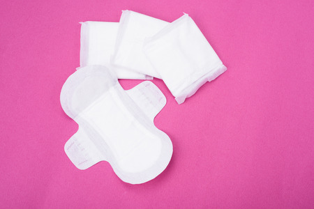 Woman hygiene protection (sanitary) on paper backgroundの写真素材