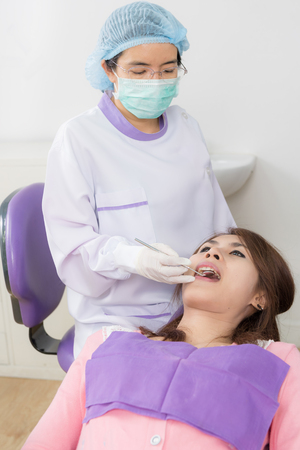 Dentist examine asian woman patientの写真素材