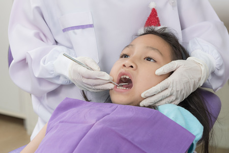 Dentist examine asian girl patientの写真素材