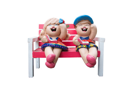 Pottery dolls sit on the chairの写真素材