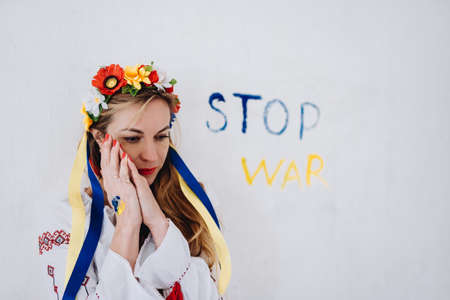 Ukrainian girl sad crying war in Ukraine. Stop war.