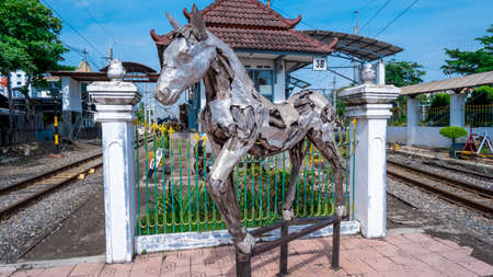 Yogyakarta, Indonesia - Nov 19, 2021: Landscape photo of Unique horse statue made from a combination of wood and metal. The iconic horse statue for tourists visiting the city of Yogyakarta.のeditorial素材