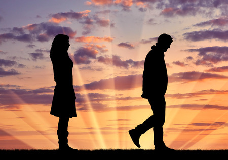 Concept of deceit and betrayal. Silhouette man leaves from the woman to his mistress at sunset