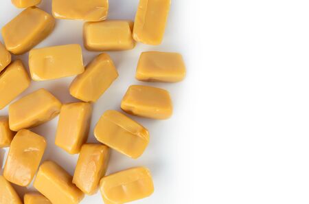 Caramel toffee scattered. Design element isolated on white backgroundの写真素材