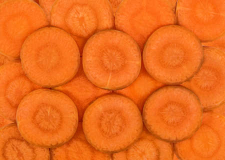 Sliced carrot discs. Background close upの写真素材