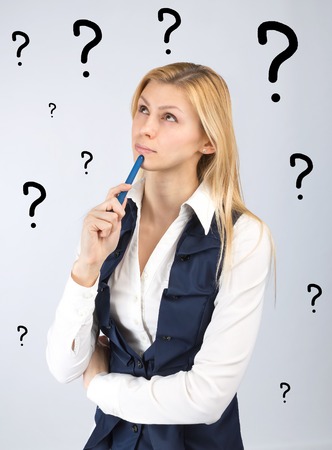 Concept of ideas and thoughts. Thinking business woman with a pen in handの写真素材