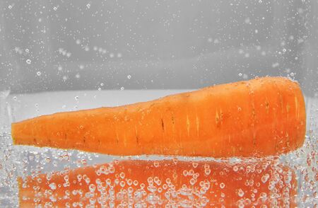 Juicy carrots in water. design elementの写真素材
